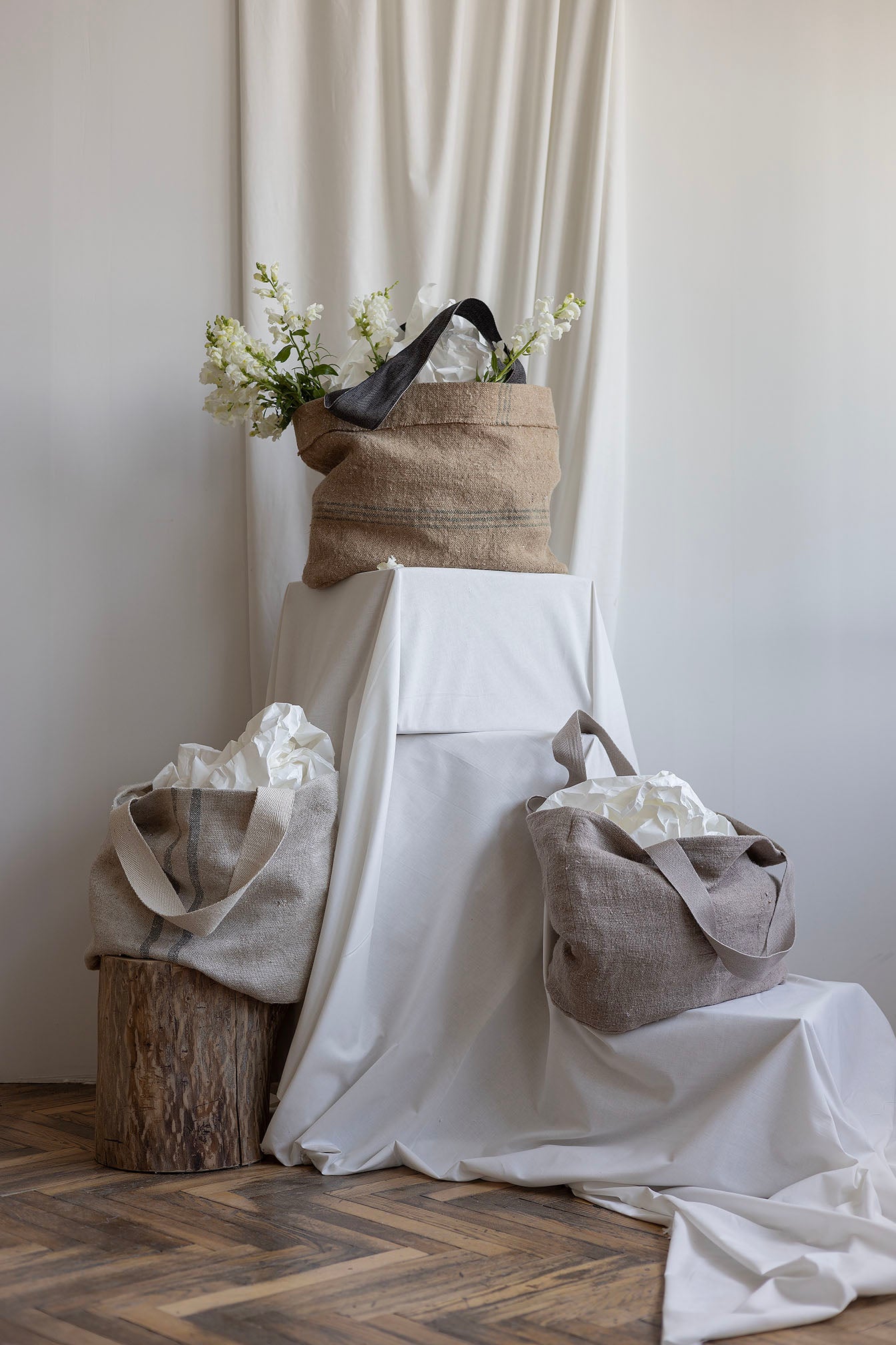 Striped Abundance bag with dark grey shoulder straps